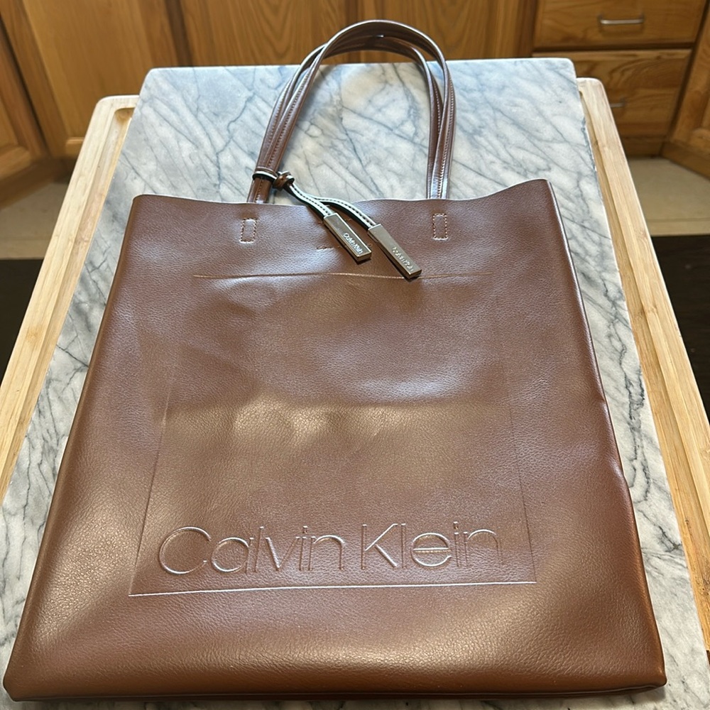 Calvin Klein pocketbook/bag. New without tags- Never been used. Pristine.